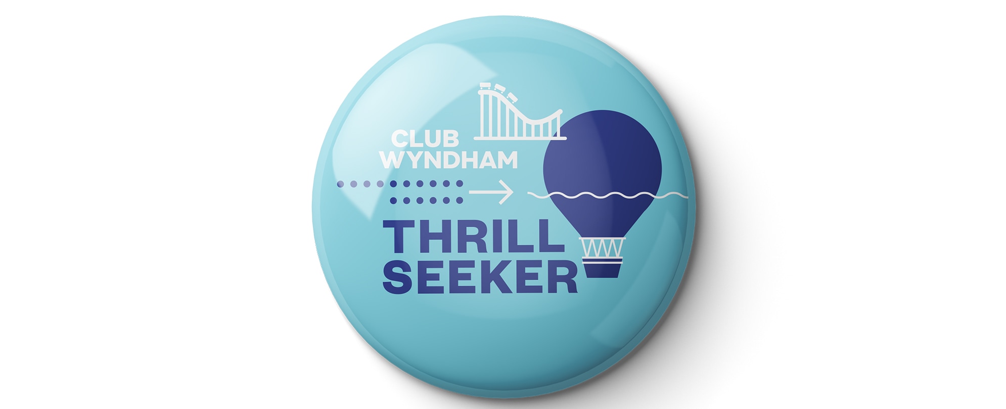 A blue "Thrill Seeker" Club Wyndham pin