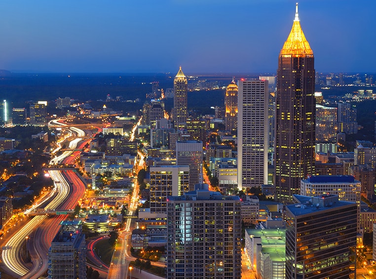 A rooftop city view of Atlanta at night.