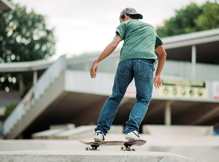 A boy on a skateboard.
