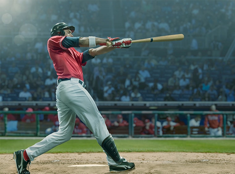 An african american professional baseball player, hitting a ball.
