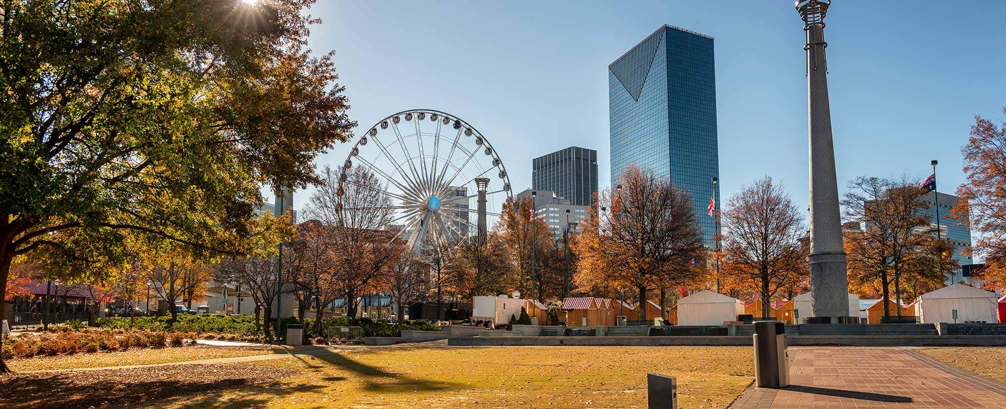 Ferris Wheel and tall buildings at Centennial Olympic Park in Atlanta, Georgia.