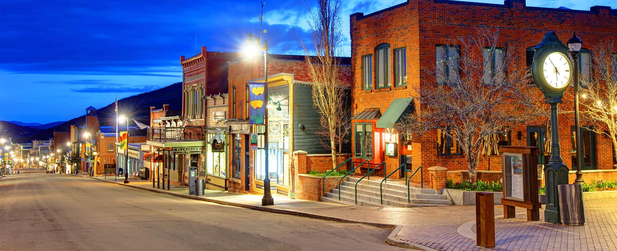 Main Street in Park City, Utah, a small downtown lit up at night.