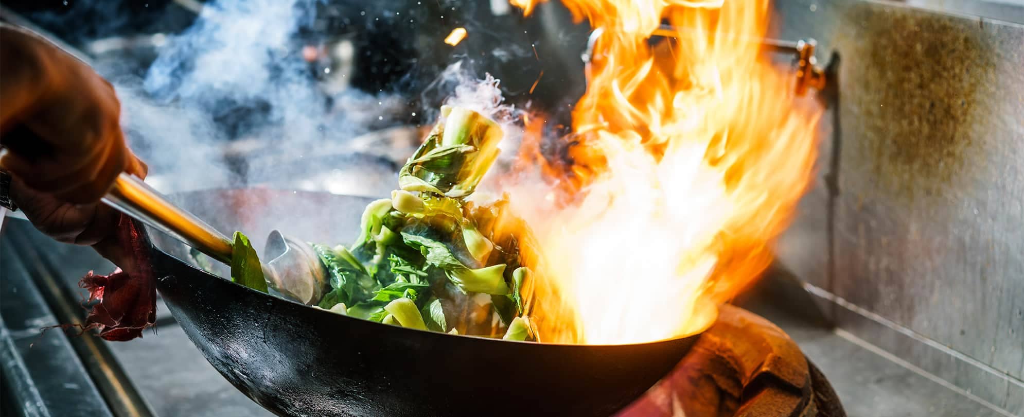 Vegetables being cooked in a wok at Riverhorse On Main, a restaurant in Park City, Utah.