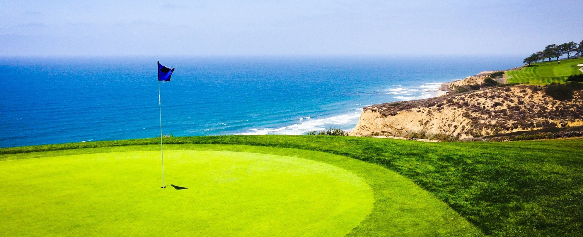 The putting green of an oceanfront golf course in San Diego, California.