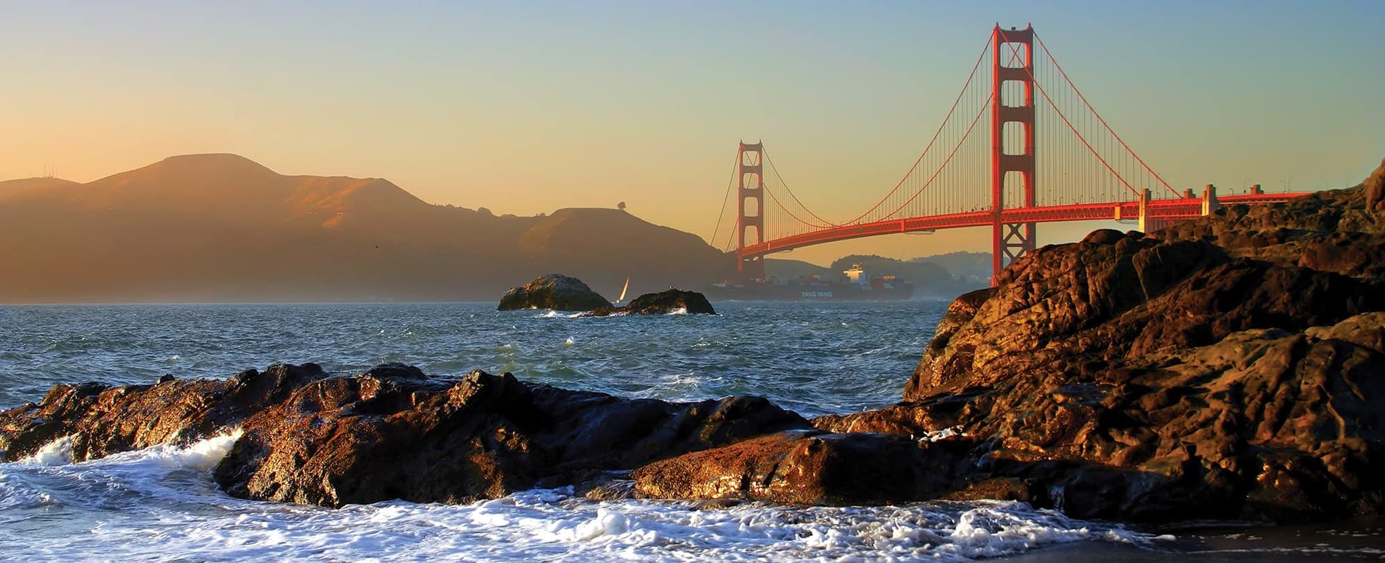Rocks in the water in front of the Golden Gate Bridge in San Francisco, California