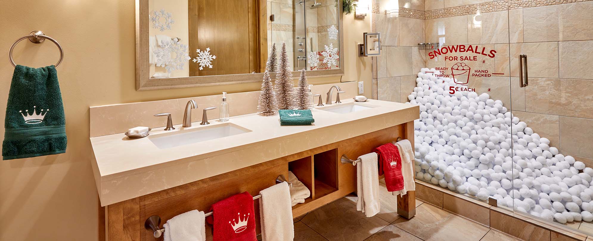 A decorated Hallmark Channel Countdown to Christmas Holiday suite bathroom with snowballs filling the walk-in shower at Club Wyndham Resort at Avon.