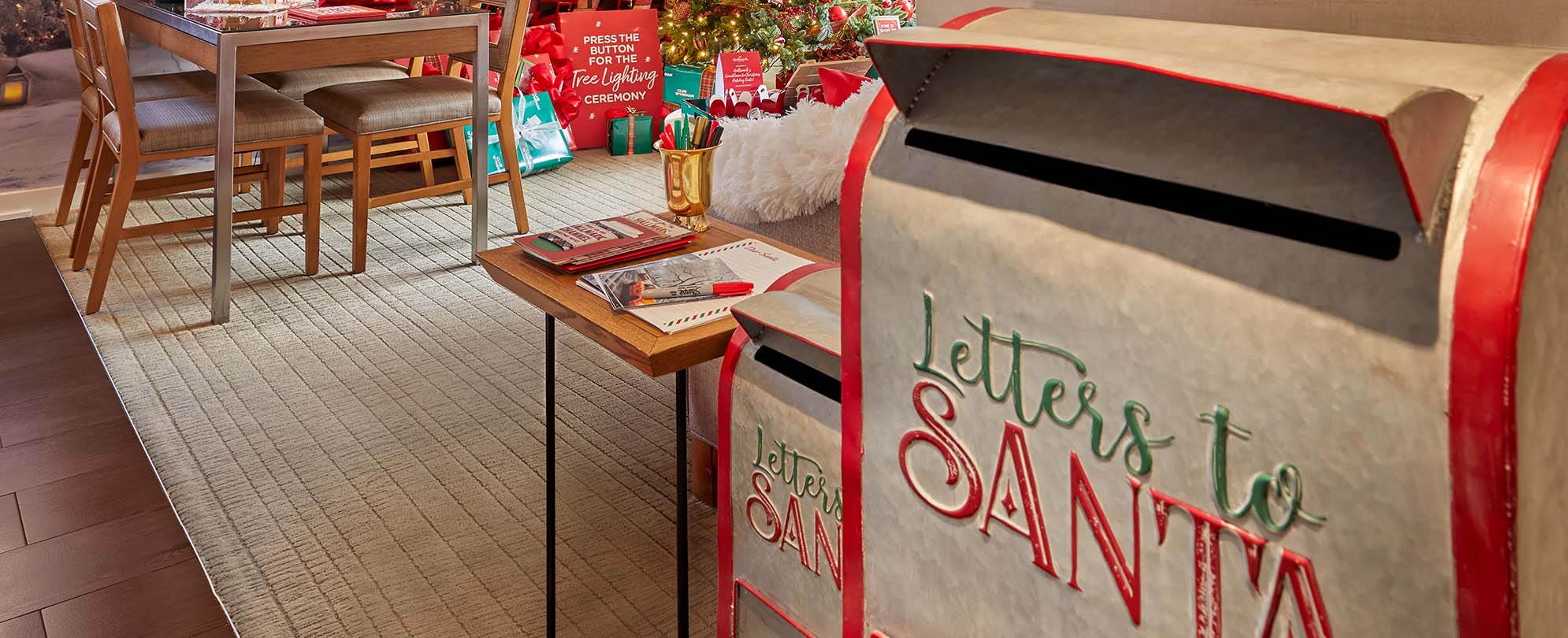 A Letters to Santa mailbox, and a living area decorated in Christmas decorations for the Hallmark Channel, Countdown to Christmas Holiday suite in New York
