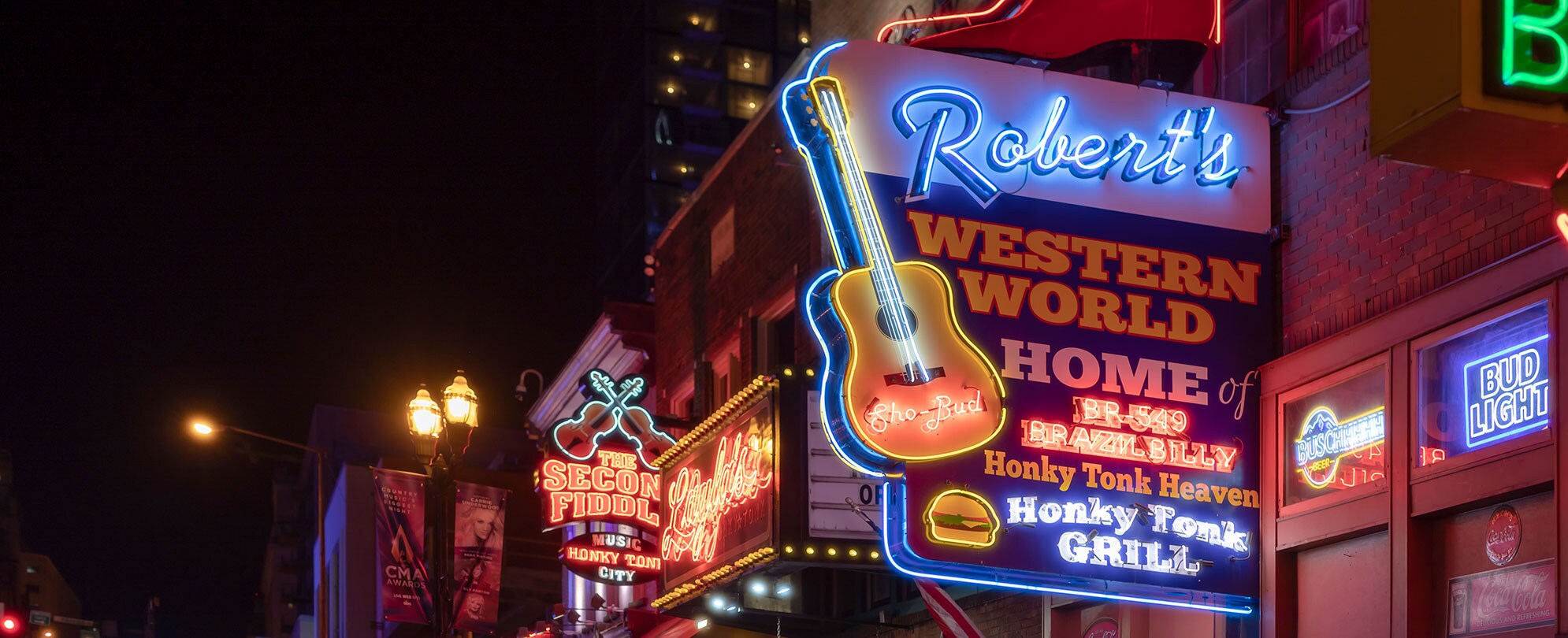 Neon signs for Nashville, TN bars along Broadway.