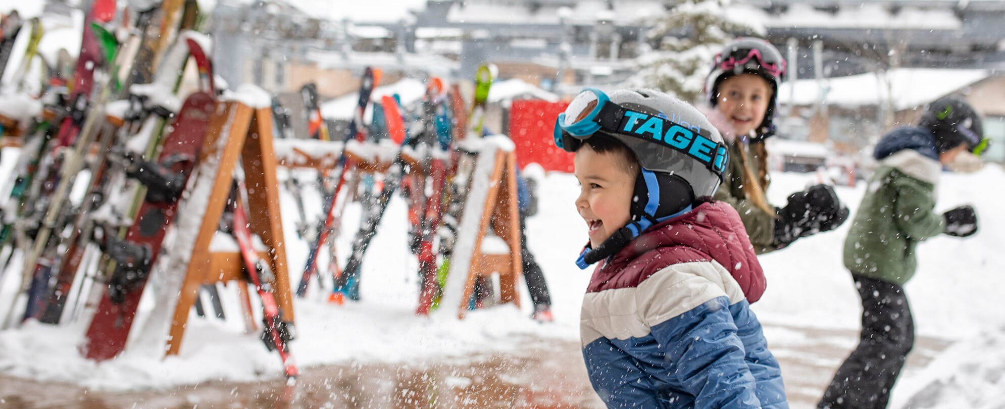 Children laughing and playing in the snow in Park City, Utah