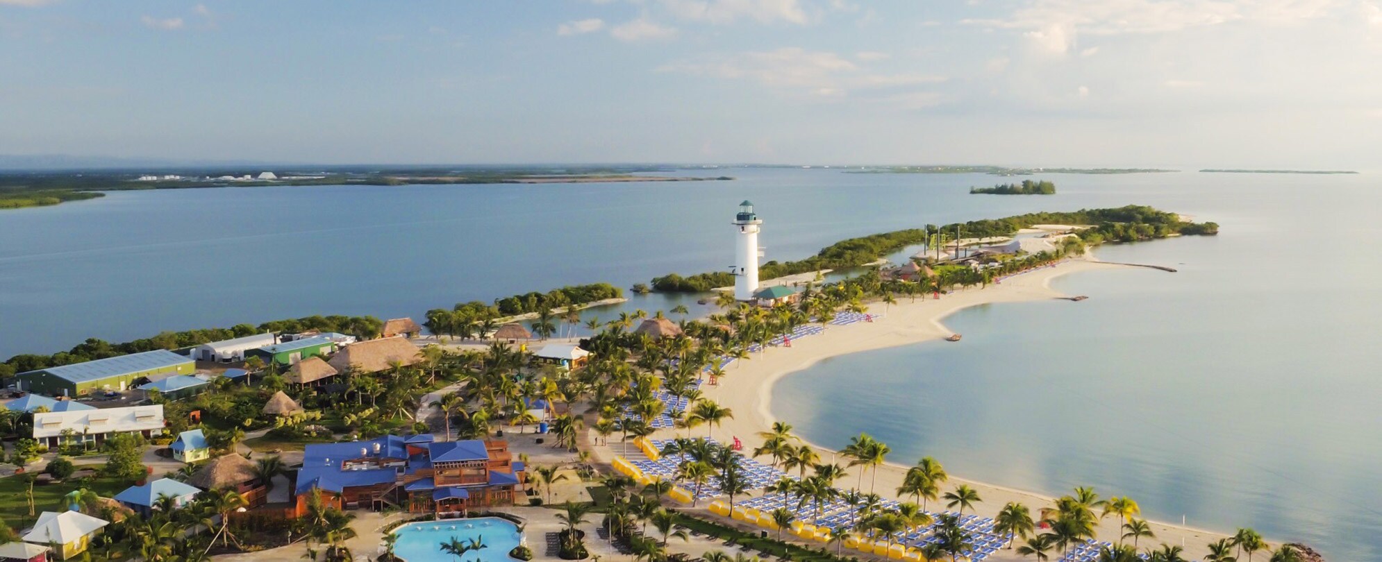 Sand, palm trees and sparkling water at a Western Caribbean resort with Club Wyndham.