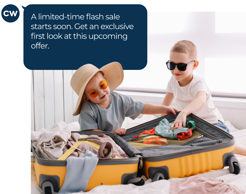 Two kids in sunglasses packing a suitcase
