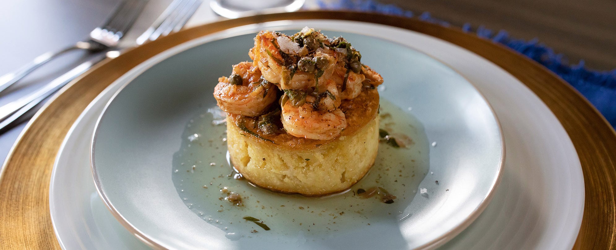 A plated meal with shrimp from a Club Wyndham private chef.