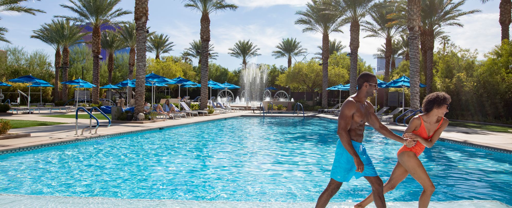 Couple at the CW Desert Blue pool