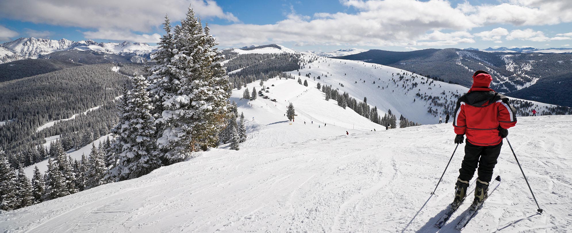 Person skiing down a snowy hill on their Club Wyndham vacation.