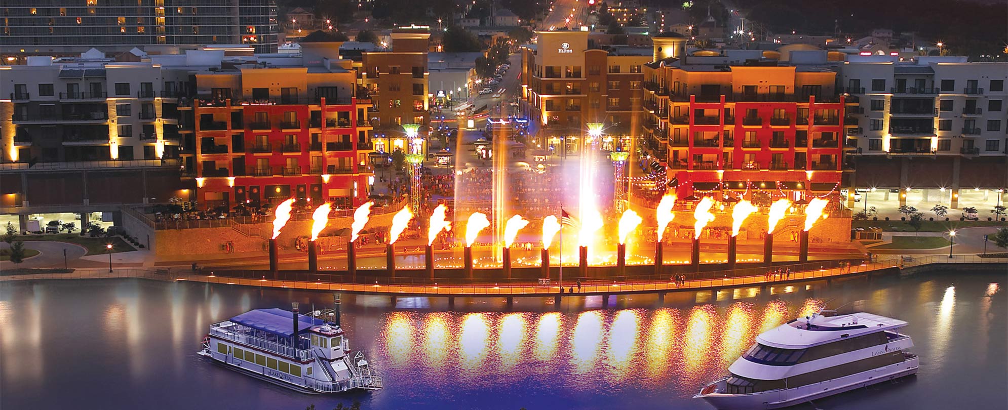 Fifteen pillars lit up in flames along the water in Branson, Missouri.