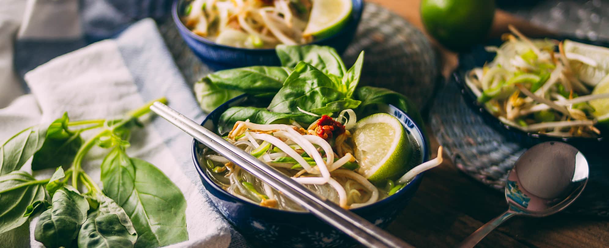 A bowl of Vietnamese Pho noodles with chopsticks from the Little Saigon neighborhood in Westminster, California