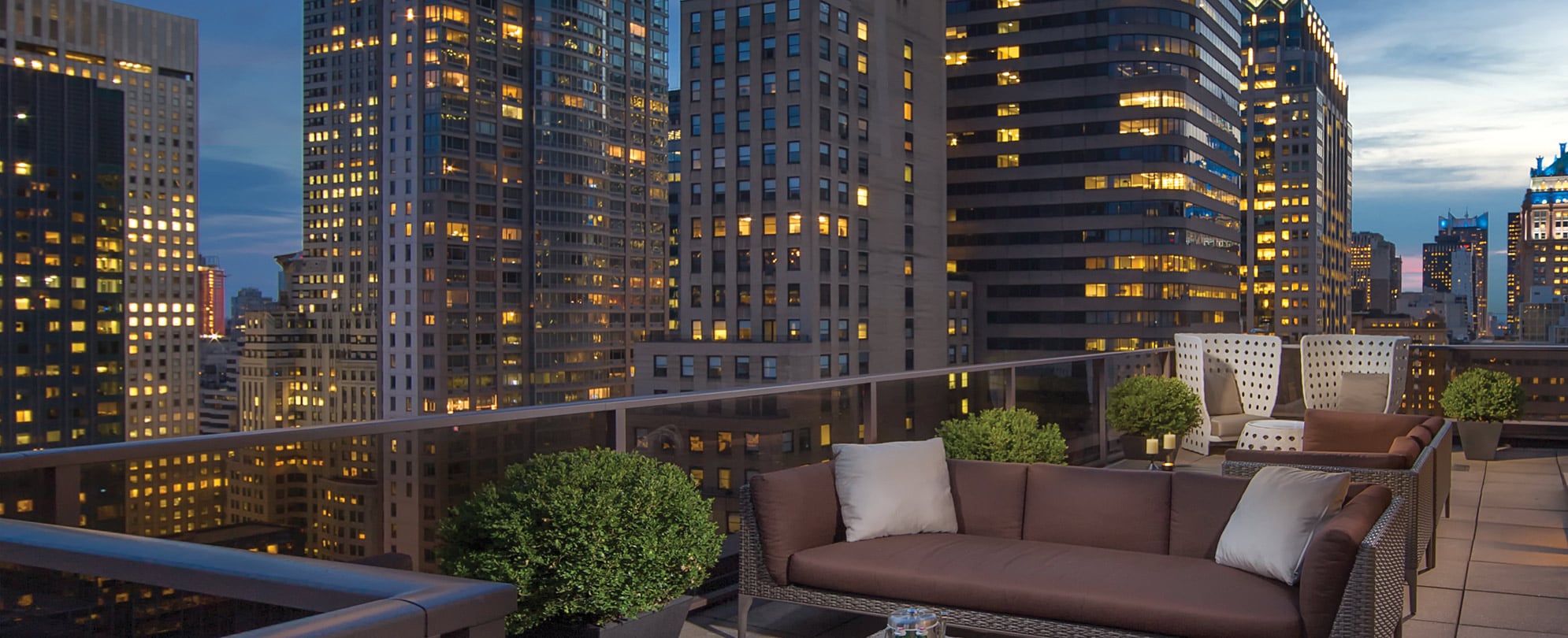 The rooftop terrace of the Club Wyndham Midtown 45 resort overlooking buildings in New York city