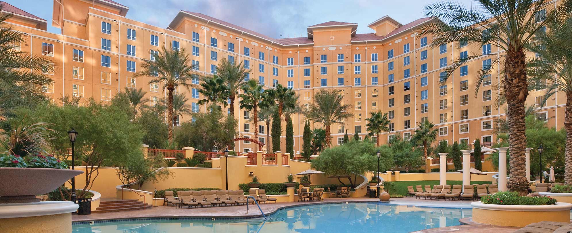 The Club Wyndham Grand Desert resort overlooking an outdoor pool with palm trees