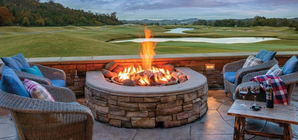 Chairs and wine surround a fire pit overlooking the golf course at Club Wyndham Great Smokies Lodge in Sevierville, Tennessee