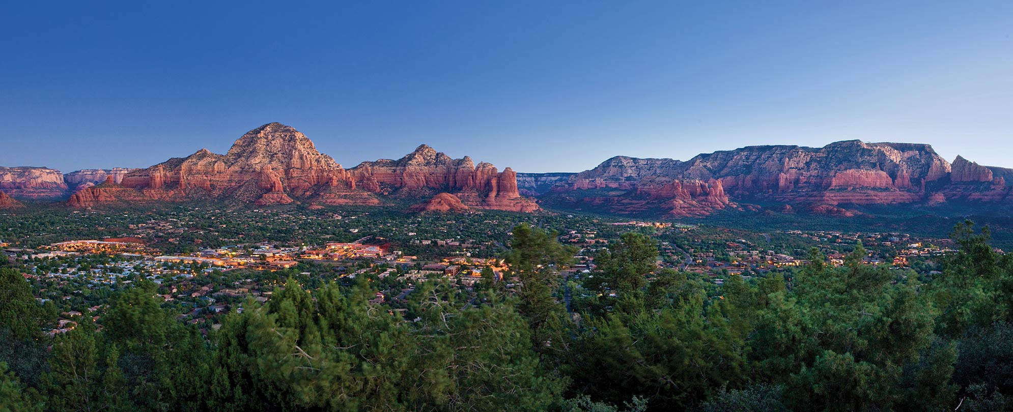 An aerial of Sedona, Arizona, and its surrounding red rock formations