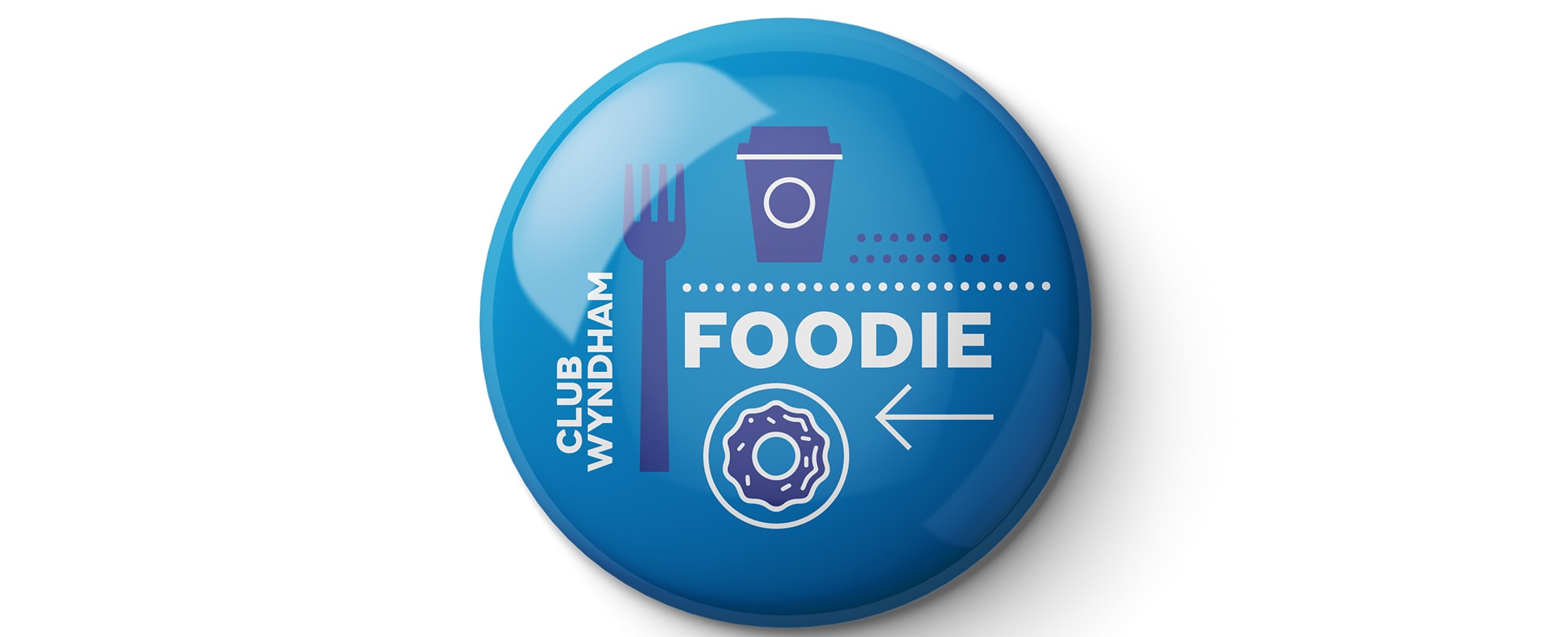 A blue "Foodie" Club Wyndham pin