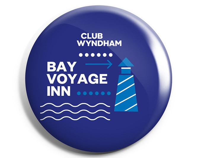 A blue "Bay Voyage Inn" Club Wyndham pin