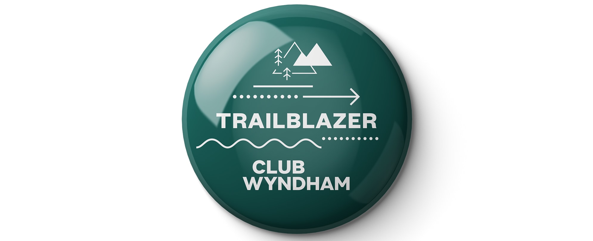 A green "Trailblazer" Club Wyndham pin