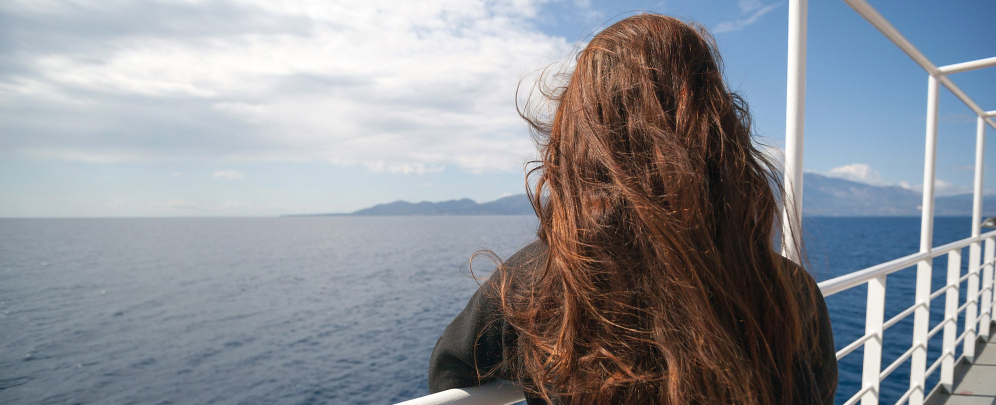 Passenger of cruise ship looking at sea