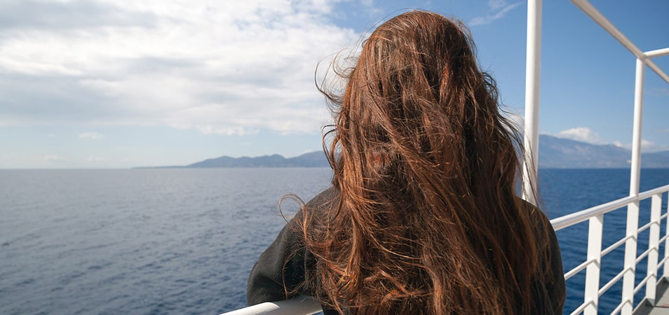 Passenger of cruise ship looking at sea