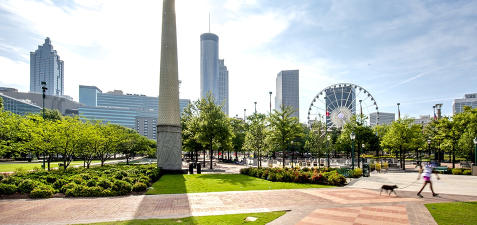 Daytime shot of downtown Atlanta’s Centennial Olympic Park with the SkyView Ferris wheel in the background.
