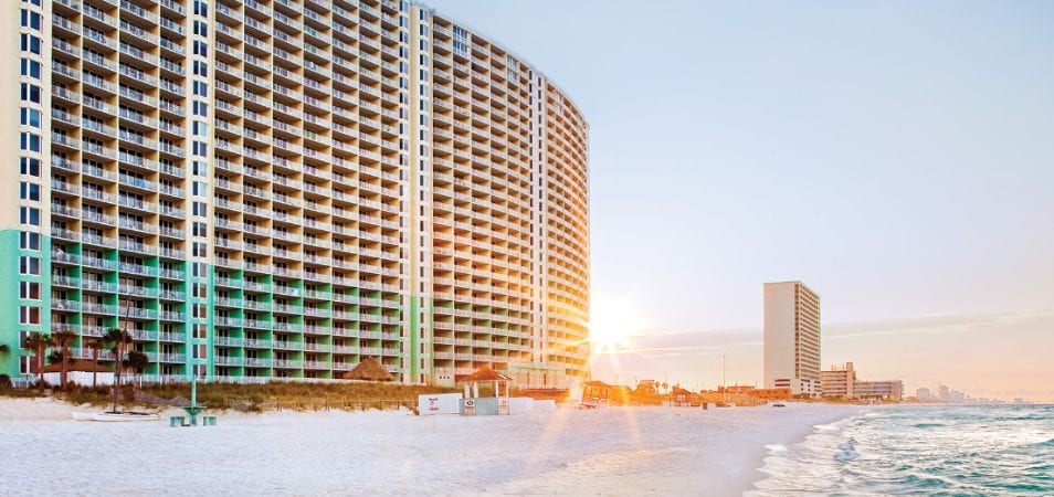 The exterior Club Wyndham Panama City Beach, an oceanfront timeshare resort in Panama City Beach, Florida at sunset.