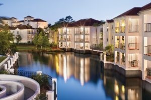 The buildings and balconies of Club Wyndham Star Island, a timeshare resort in Kissimmee, FL, situated along a canal.